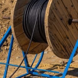 wooden-coils-of-electric-cable-outdoor-high-and-l-2023-11-27-05-01-39-utc-small